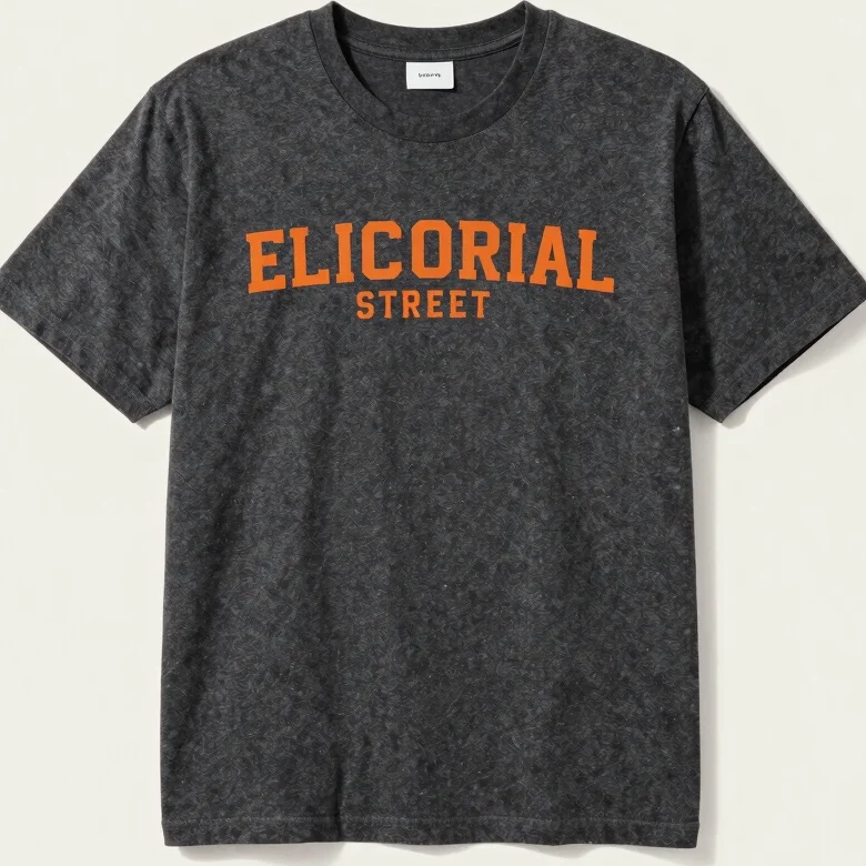 Editorial streetwear photograph, 35mm, soft studio light, close detail of a charcoal graphic tee fabric and printed moti